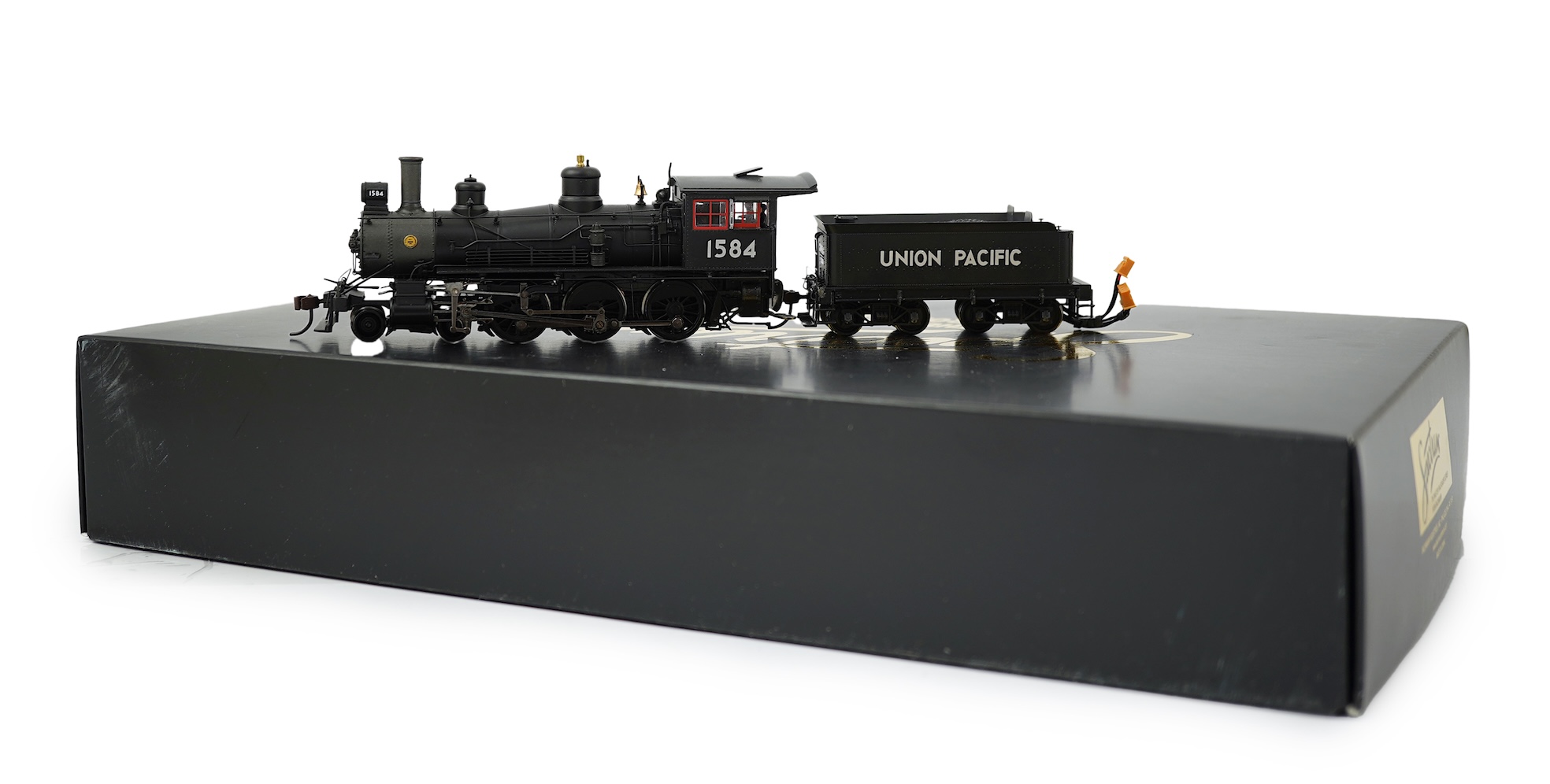 A boxed HO gauge Spectrum by Bachmann model (82303) of Baldwin, 1584, 4-6-0 locomotive with bogie tender, powered for two rail operation.